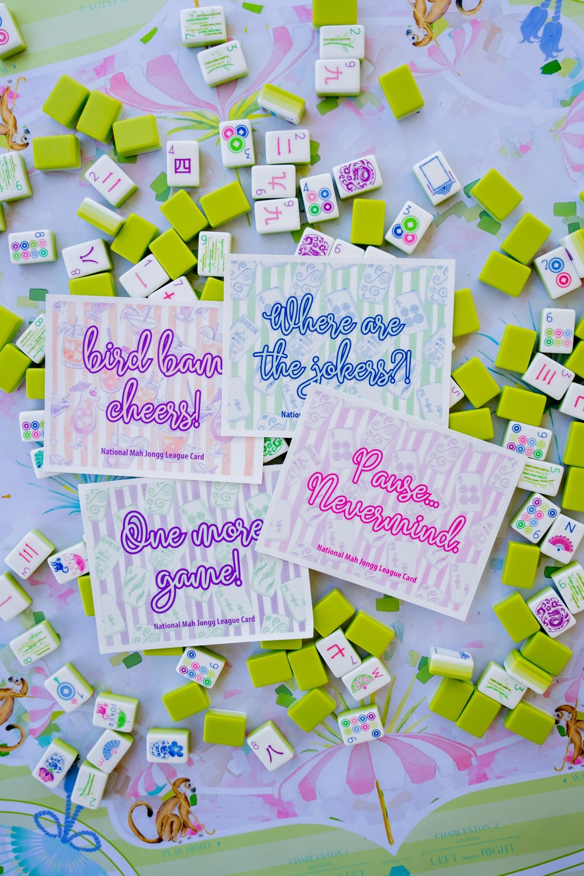 Colorful game tiles with printed phrases on a colorful background